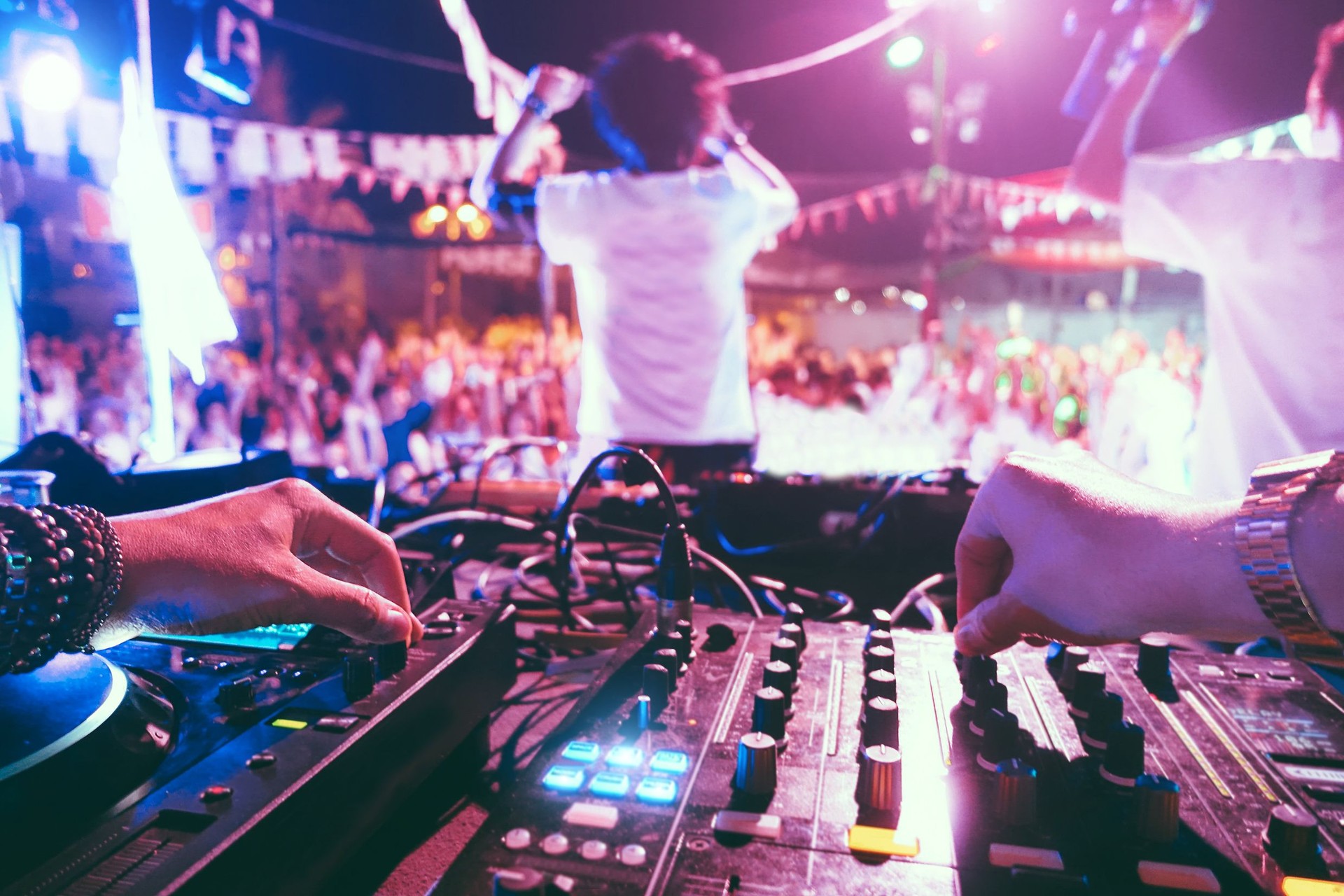 Cropped Hands Of Dj Playing Sound Recording Equipment In Club